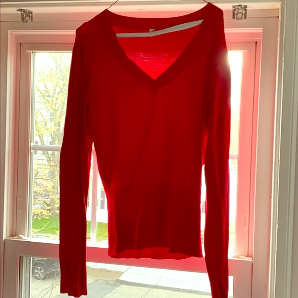 Soft Red v neck sweater made with nylon.